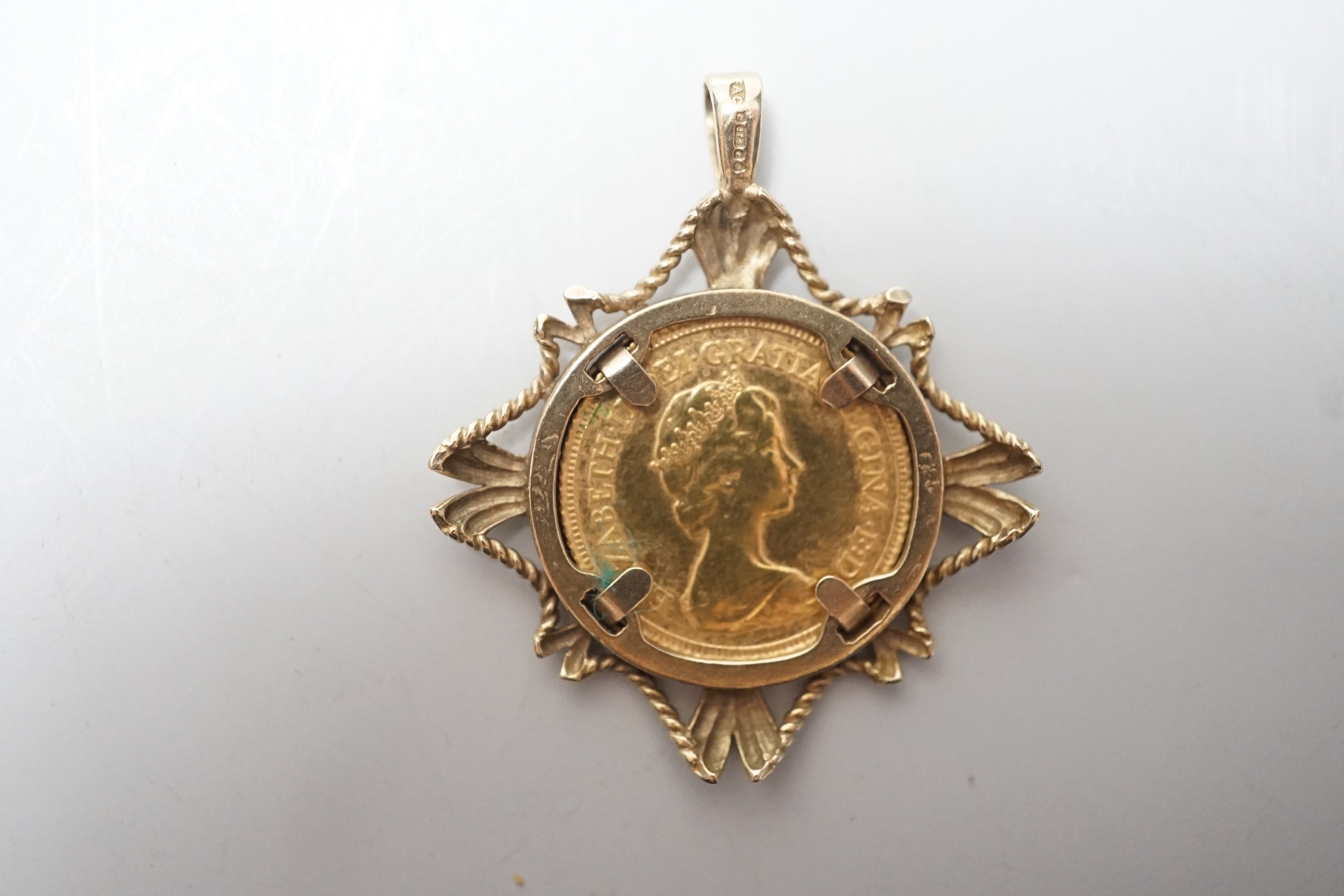 An Elizabeth II 1982 gold half sovereign, in 9ct gold pendant mount, 7.7 grams.